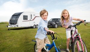 Brother and sister with bicycles