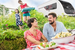 Young couple sharing picnic lunch, Tyrol, Austria